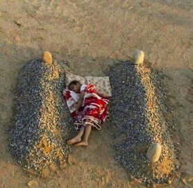 Orphaned Syrian Boy Sleeping Between his Parents’ Graves. The photo, as captioned, tugged at the heartstrings. So it was no surprise that it quickly went viral. But it was soon revealed to be a staged shot taken by a photographer in Saudi Arabia as part of a conceptual art project. The graves were fake, and the boy was the photographer's nephew. The photographer, 24-year-old Abdel Aziz Al-Atibi took the photo of his nephew Ibrahim on January 3, 2014. He then posted it to his Instagram account, with the message, "Some kids might feel that their dead parents' bodies are more affectionate to them than the people they're living with." He later explained to beirut.com: "I'm a photographer and I try to talk about the suffering that is happening in society, it's my hobby and my exaggeration is intended to deliver my idea." The image quickly went viral, but as it did so people assumed it showed a child whose family had been killed during the conflict in Syria. And it quickly gained a caption to that effect. When Al-Atibi learned of how the photo was being misunderstood, he uploaded more photos showing other shots of his nephew during the photoshoot, to demonstrate that the scene was a staged art project. http://hoaxes.org/photo_database/viral_images